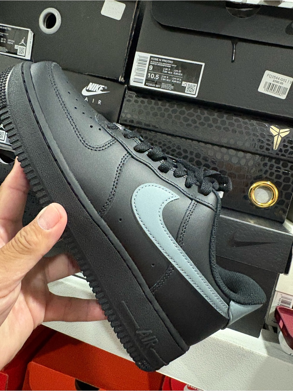 Nike Black Leather Low-Top Sneakers with Light Grey Swoosh